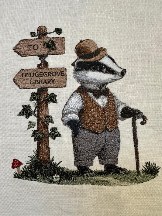 Embroidered badger at a wooden gate with signs on a textured fabric background